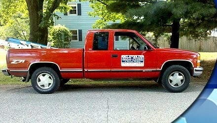 Old City Wide website banner with their red work truck